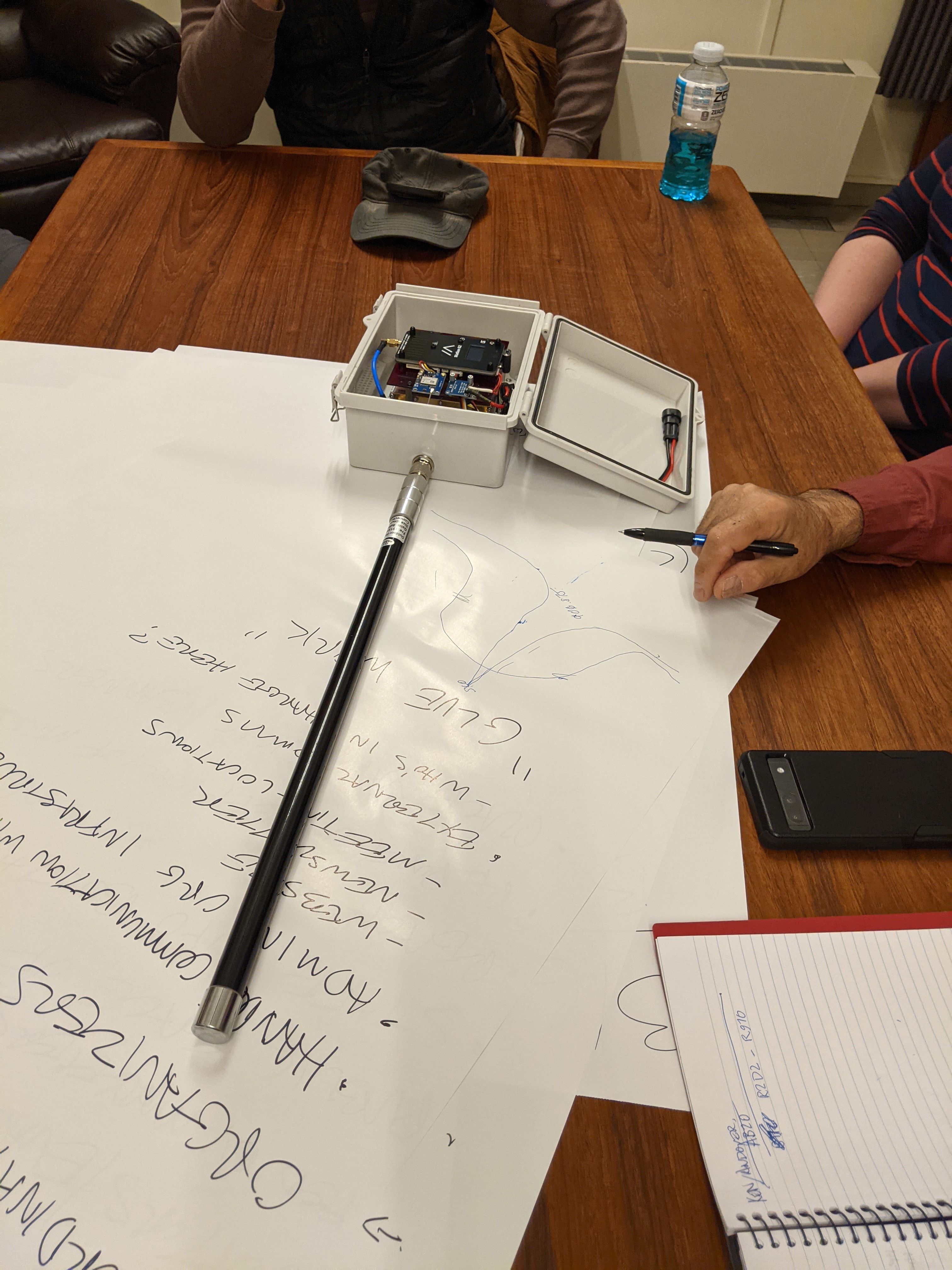 Attendees gathered around the open node enclosure